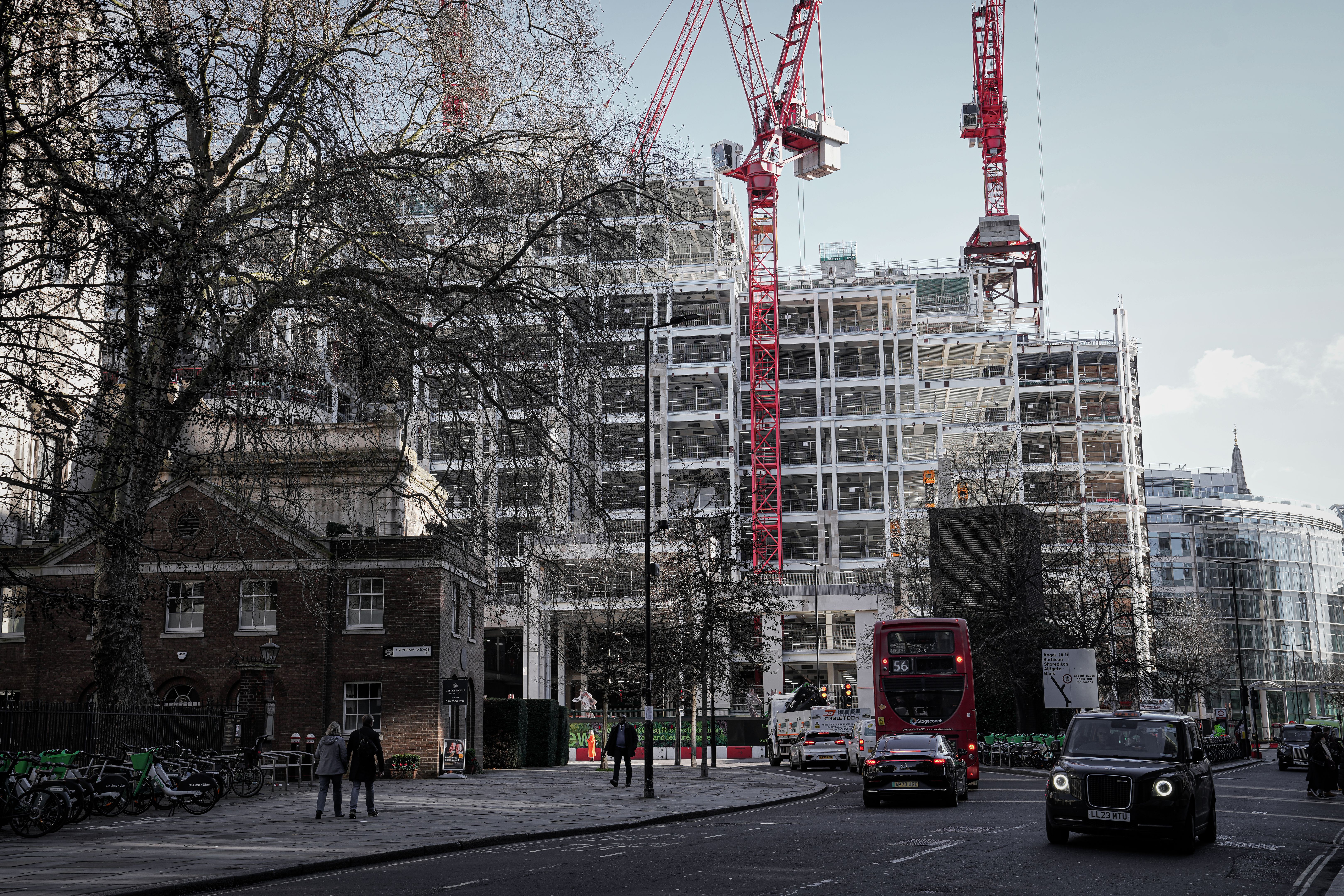 Redevelopment - Construction site at Cheapside street, King Edward Street & newgate Street (north of St Paul's Cathedral) daytime street view in central London, England United Kingdom